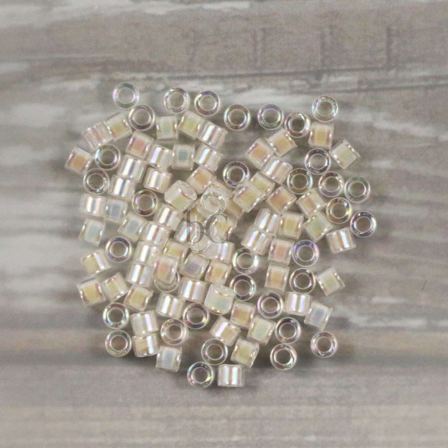 Miyuki 10/0 Delica Seed Beads, Off White AB Transparent # 52 ~ 7.2 Grams